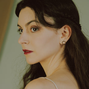 Close-up of a model wearing Classic MIMOSA rose gold Earrings 2 Diamonds, without chains