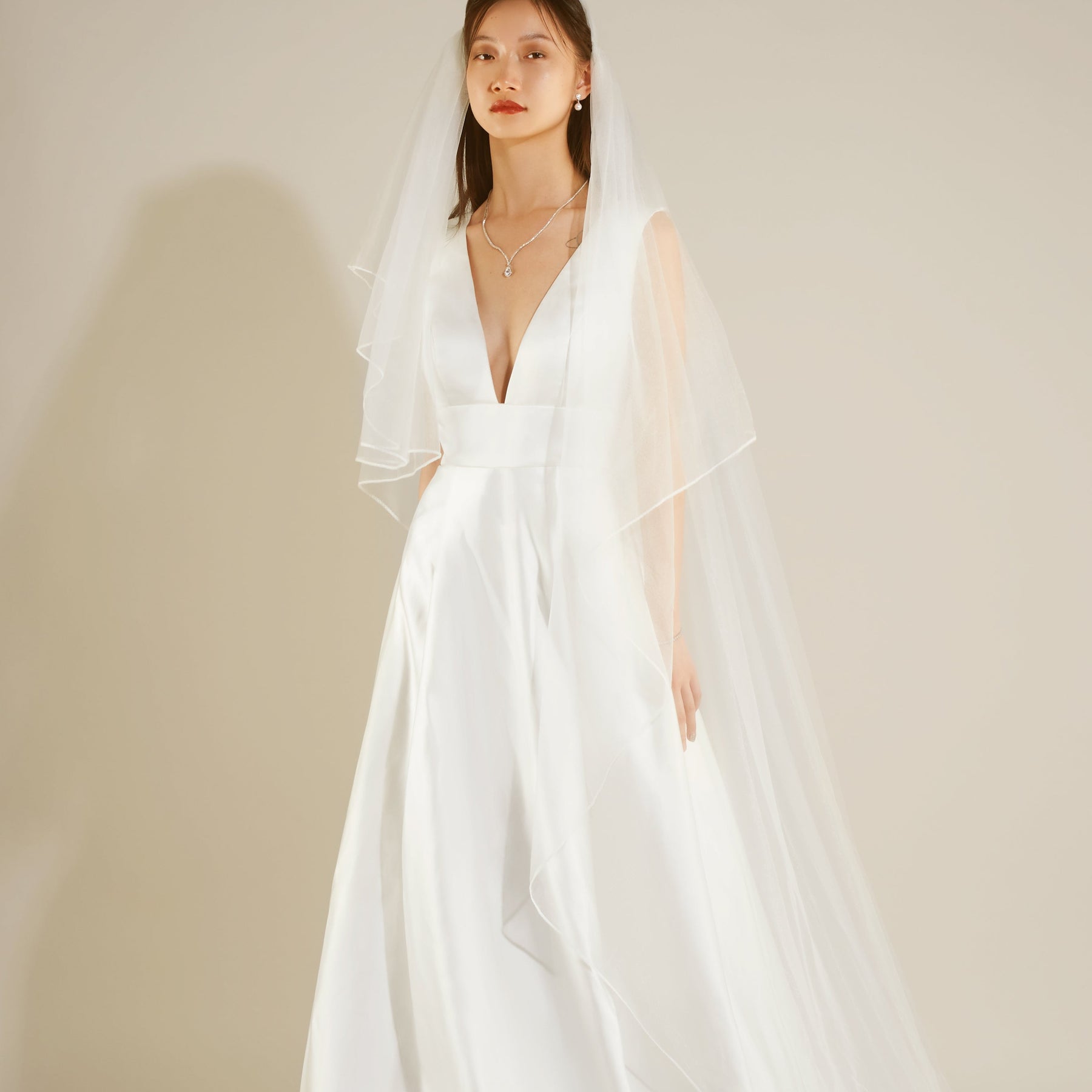 The front of a model wearing a white MARGUERITE Wedding Dress